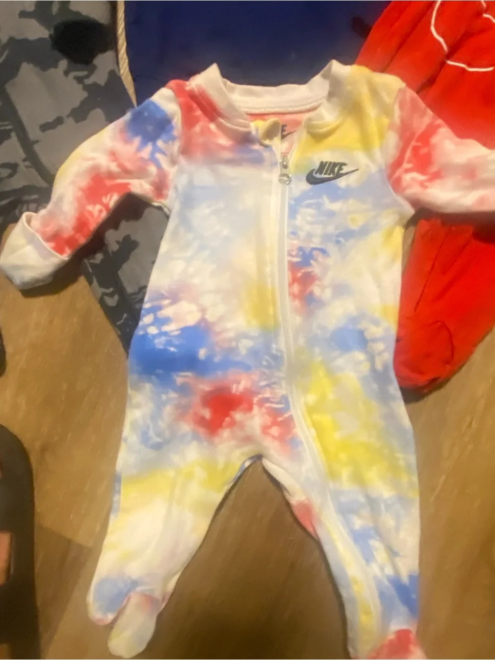 3 Nike Kids Tie-Dye Zip Front Footed One-Piece and 1 navy Nike Zip-Up Jacket